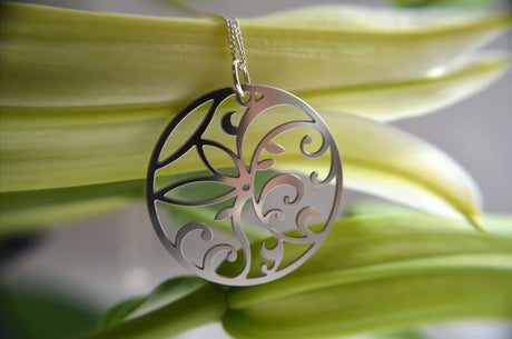 Floral Circle Pendant in stainless steel